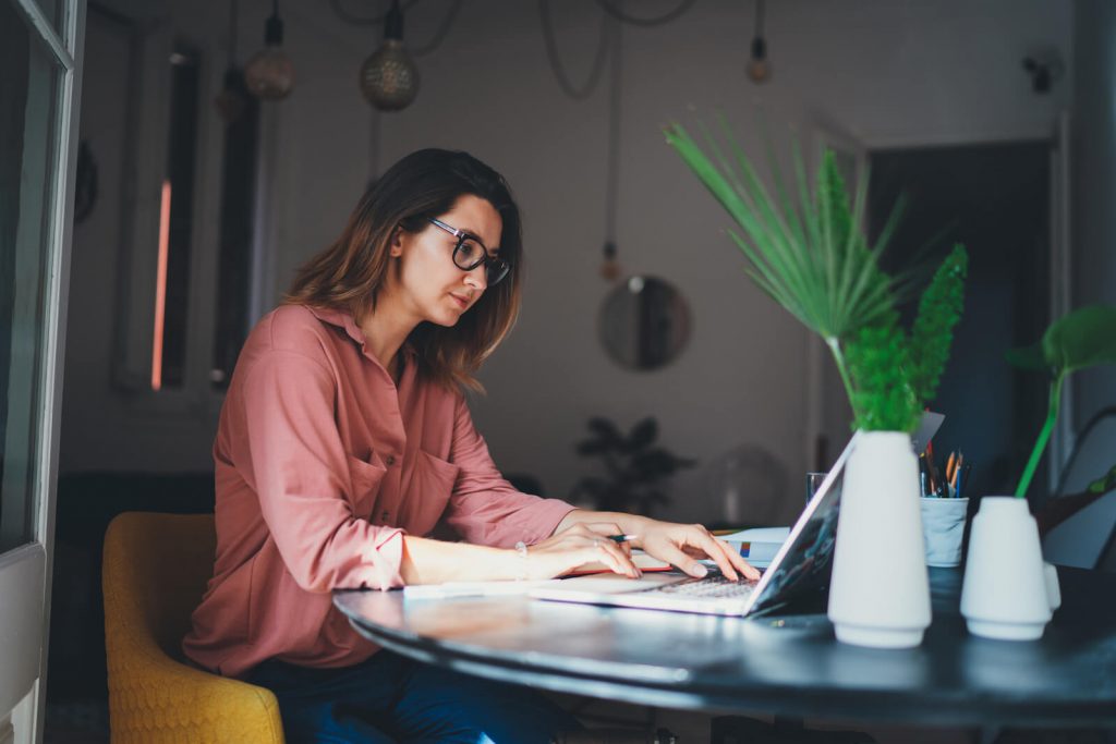 Woman working remotely using a laptop